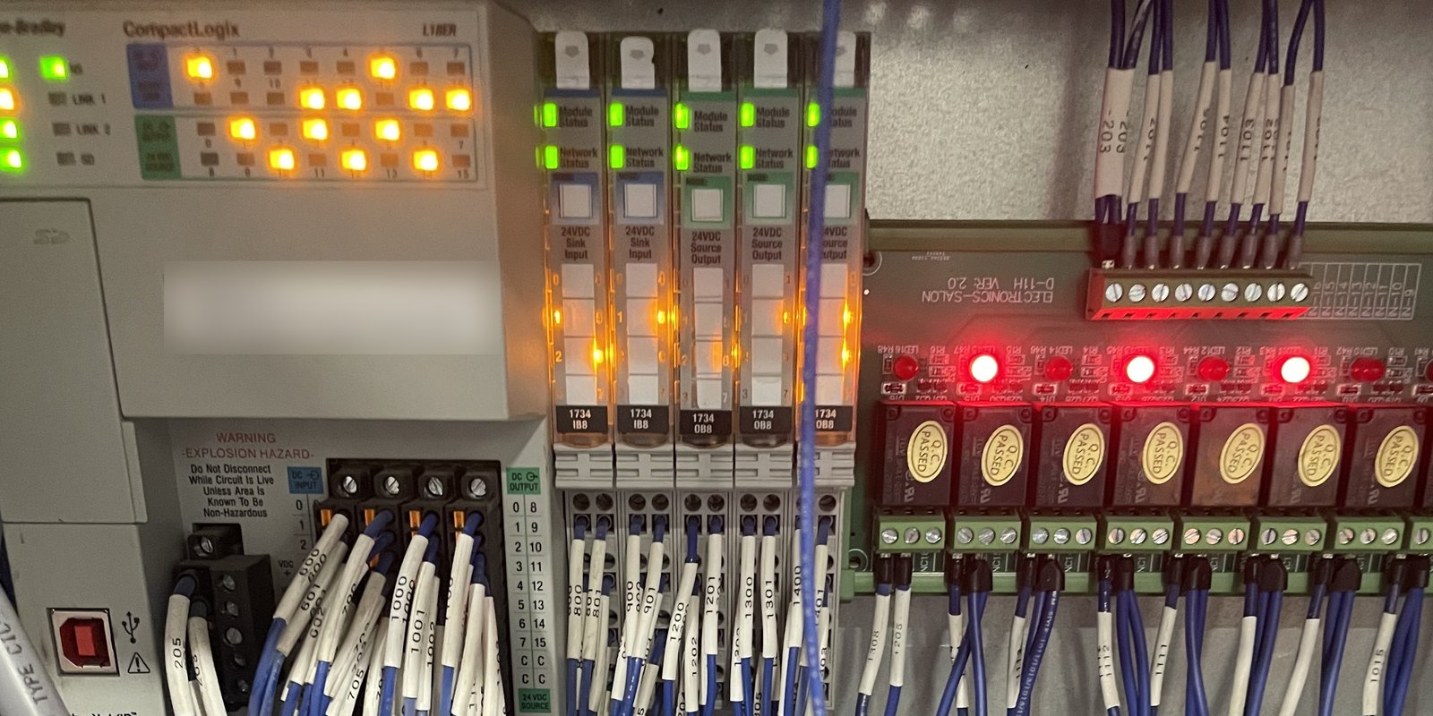 Allen-Bradley CompactLogix with POINT I/O and relay boards in a control panel.